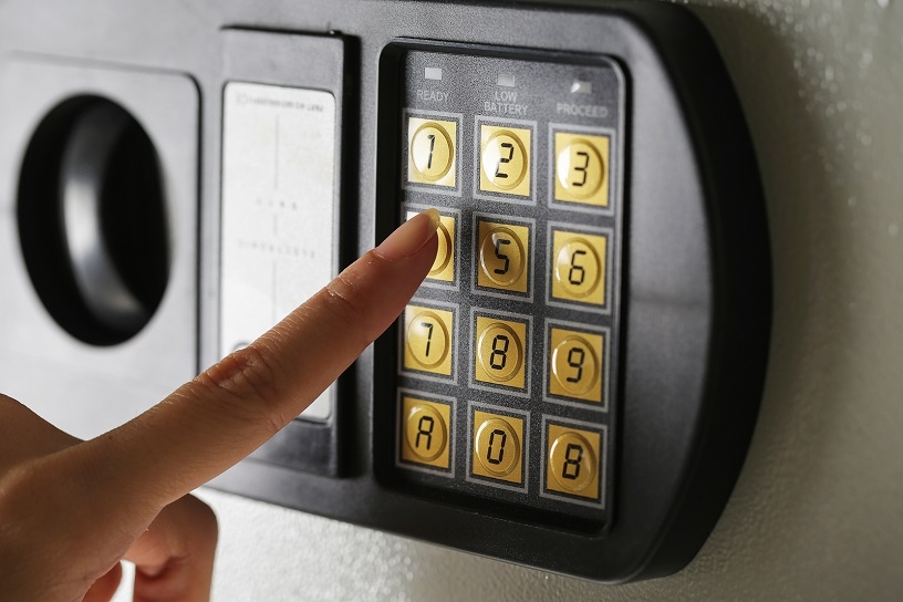 A person using a combination safe.