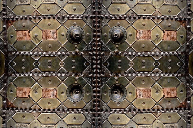 An ancient oriental door with old lock.